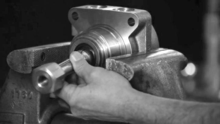 A blind hole bearing or seal puller is required. SEE FIGURE 21 Figure 21 Inspect housing assembly 17.