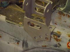 The paint around the markings should be removed before welding the bracket to the frame rail to insure a good weld.