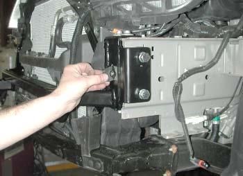On each side, place the two 1" x 1" pipe spacers between the main receiver brace and the side of the frame rail.
