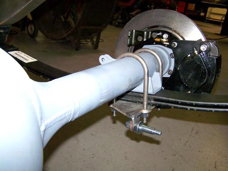 Clamp the rearend to the leaf springs using the U-bolts, 5- hole plates, and ½-20 nylock nuts.