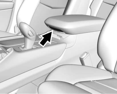 Press the button on the driver side of the cover to access the storage area under the armrest.