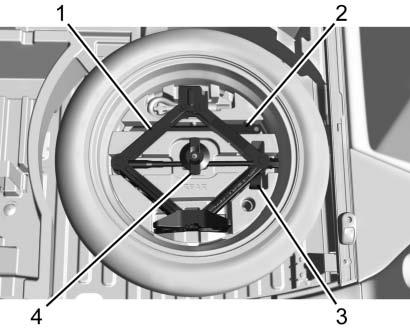 Turn the wing nut (4) counterclockwise to remove the jack (1), wheel wrench (2),