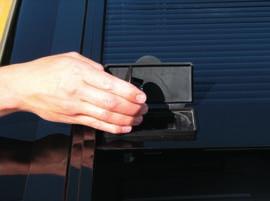 During the break-in period more effort may be needed, but you still should be able to roll the cover open and closed with one hand.