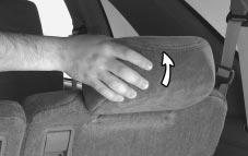 On two-door models with an inside mounted spare tire, the driver s side rear seat head restraint must be lifted and held upright as the seatback is raised.