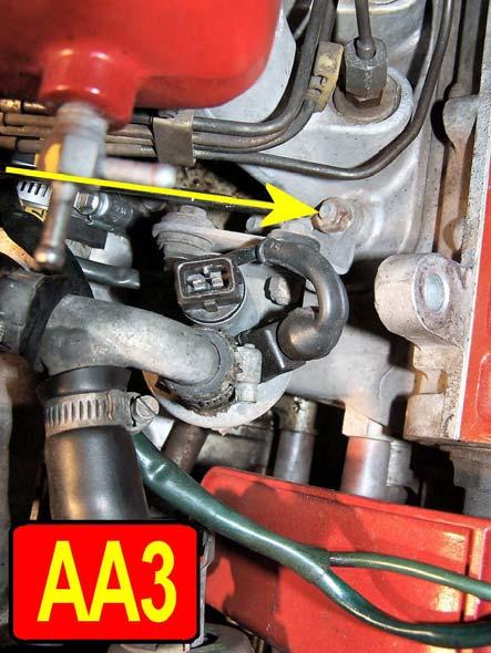 Find and remove the two 13 mm nuts hold it down to the right front intake runner where the