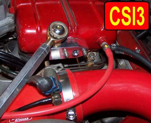 Clean the mounting surfaces on the intake manifold and the CSI now. Locate the Cold Start Injector adapter bracket from your kit as shown in picture CSI2.