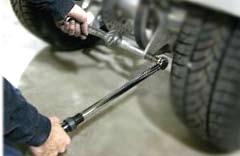 8. Have a friend help hold the swing arm. Install spoke previously removed as shown.