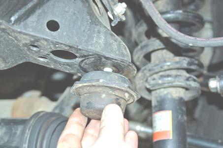 62. Using a 3 adjustable wrench, or strap wrench, remove the factory bump stop. See PHOTO 47. 63.