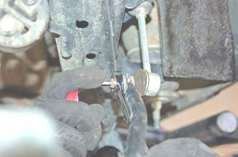 See PHOTO 53. 5. Using a 19mm wrench and socket, remove the rear track bar from the axle and frame mount. Retain stock hardware for re-use. See PHOTO 54.