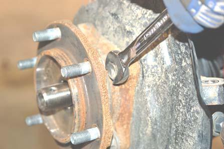 Using zip ties or wire, be sure to support the CV axle before removing the lower control arm.