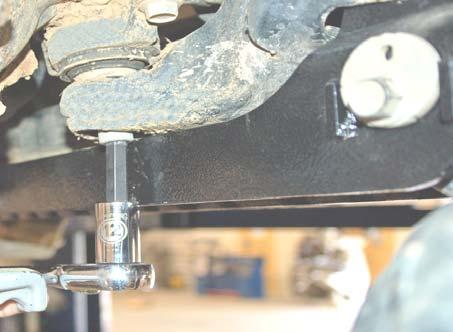 Remove the rear differential bracket using a 12mm allen socket