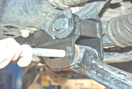 Using the factory hardware install the bolts in the bottom of the bracket into the differential as shown in