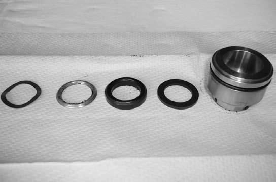 Replace O-Ring (included in Seal Kit) around outside of Seal Retainer. 12. Lightly lubricate seal bore and insert Seal Retainer. Even force will allow Seal Retainer to slide into position. 13.