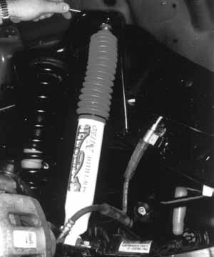 (See Photo # 4) 10. Install the new Skyjacker coil springs. Raise the jack up so that enough load is applied to hold the new Skyjacker coil springs in place.
