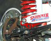 Install the new Skyjacker steering stabilizer mounting bracket with the tab over the OEM sway bar end link stud with the OEM nut.