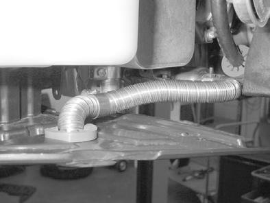 onto A/C line and position in area of exhaust end section. Insert narrow cable tie in groove and secure.