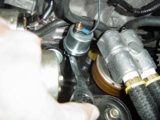 Unplug the wire from the stock oil pressure sender as shown in Photo 1-B.