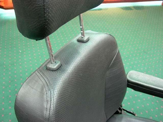 E. Headrest Height Adjustment press the button and lift up or down the headrest to your desired position let the button lock into