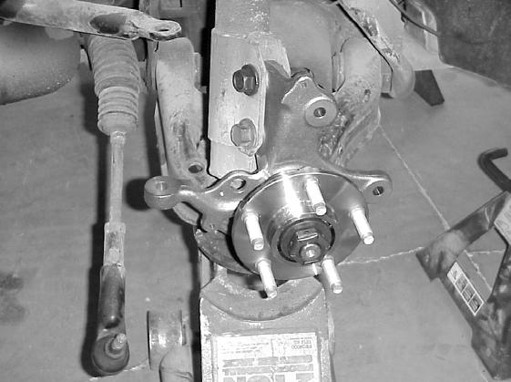 STEP 22: STEP 23: STEP 24: STEP 25: Raise the floor jack under the lower control arm until the strut can be re-attached with new bolts and nuts (Items 3, 4). Torque to 140-200 ft./lbs.