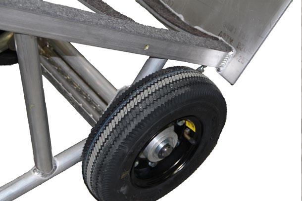 A ratchet securely tightens and locks the strap to secure the load, and rear swivel wheels help prevent loads from tipping back as well as providing