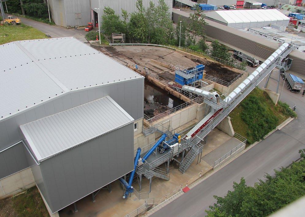 Turnkey mixing plant with an MFKG 0520 for continuous moistening of waste materials.