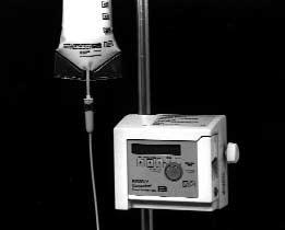 INSTRUCTIONS FOR USE 1. Attach to, or place on, appropriate feeding stand. If IV pole is used, be sure pump is properly seated in charger, and then clamp charger to pole. 2.