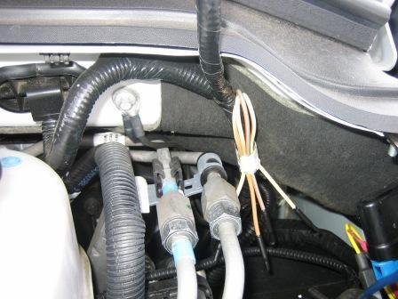 harness near the relay pack that can be found beneath the instrument panel and to the left of the steering column.