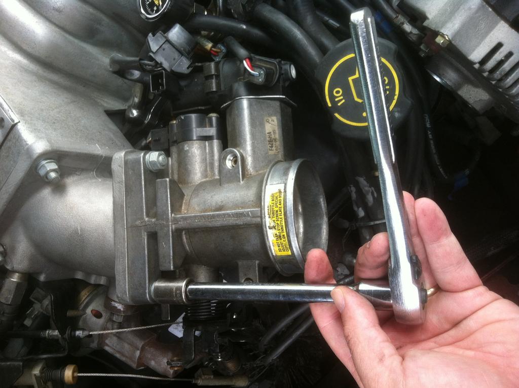 10) You are now ready to unbolt the throttle body from the intake manifold.