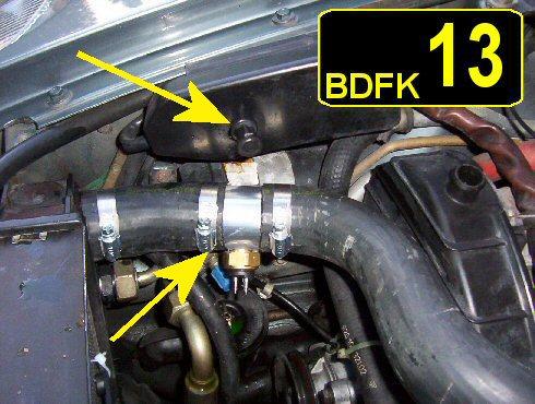 Jack up the car at the right front jacking point. This will make the upper radiator hose the high point in your cooling system and you will loose very little coolant when you cut the hose.