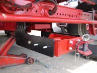 take trailer coupling carrier out. e) Attention: relieve the load of back axle of combine, for example by using a heavy jack!