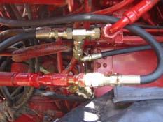 Fasten the routed hydraulic hoses with self-locking straps so, that they do not chafe on something.