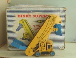 4.69B 964 Supertoys Elevator Loader. Yellow with blue 'chutes. 'Chute closure plate missing (as usual).