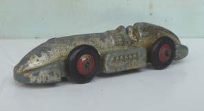 4.10 23e (221) Racing Car 'Speed of the Wind'. Silver with red wheels. Silver tinplate 'prop-shaft' baseplate. Playworn. Price ( ): 7.50 4.