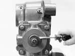 Remove the four torx head valve housing bolts (1).