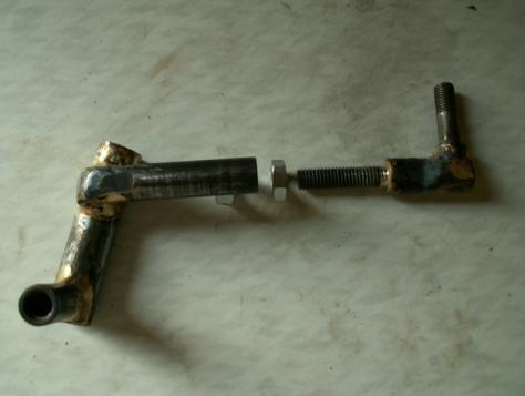 c. A short length of tapped bar (McGill Motorsport link rod) was brazed to one end of the swivel and the ball joint attached to the sleeve this resulted in a ~ 45mm lower lever from the centreline of