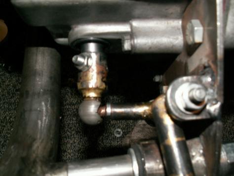 A longer rod was brazed at the top of the swivel at 90 degrees to the short lower one and horizontal to the floor (the picture to the left is an earlier version and appears to be greater than 90