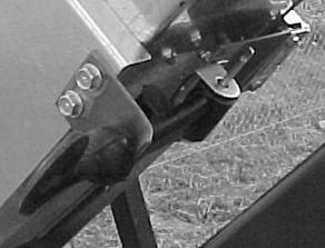 Bend the cotter pin over to retain rubber strap. Mount the assembled piece to the inner engine side guard (6) using two 1/4 x 5/8 self-tapping screws.