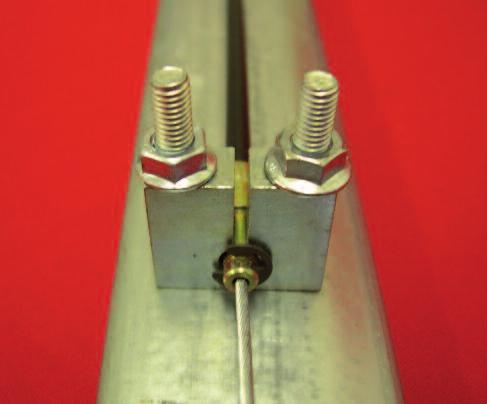 The cable post, which secures the Bowden cable outer sheath, is fixed to the door track or frame using two M6 counter sunk screws and flange nuts supplied.