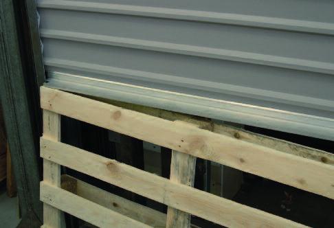 For example where a pallet (skid) has been left in a position obstructing the closing door.