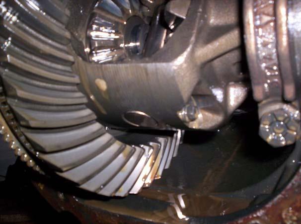 Step 7: Expose the pinion shaft; remove the retaining bolt/roll pin and shaft.