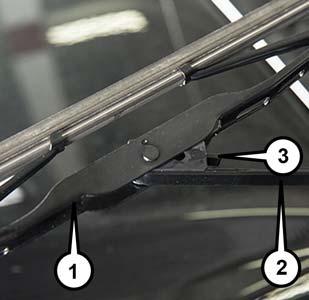 SERVICING AND MAINTENANCE Wiper Blade Removal/Installation CAUTION! Do not allow the wiper arm to spring back against the glass without the wiper blade in place or the glass may be damaged. 1.