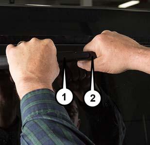 SERVICING AND MAINTENANCE 2. To remove the wiper blade from the wiper arm, grasp the wiper blade nearest to wiper arm with your right hand.
