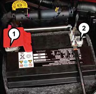 WHAT TO DO IN EMERGENCIES Preparations For Jump-Start The battery in your vehicle is located on the left side of the engine compartment. Battery Posts 1 Positive Terminal 2 Negative Terminal WARNING!