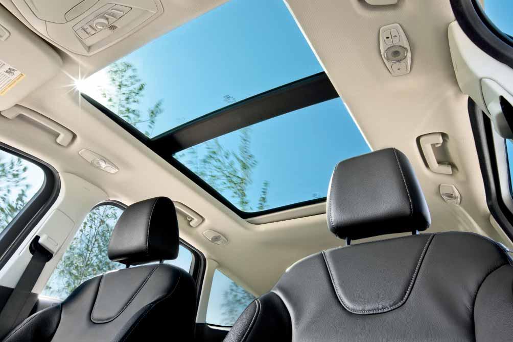 Up top, a fabric mesh deflector on the panoramic Vista Roof helps
