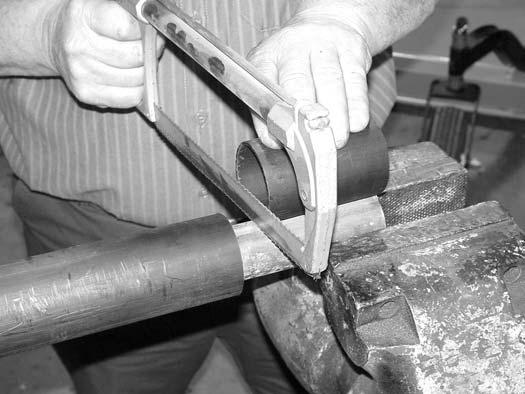 Place the cutoff portion of the shield against the end of the shaft and use as a guide. Mark and cut the shaft.