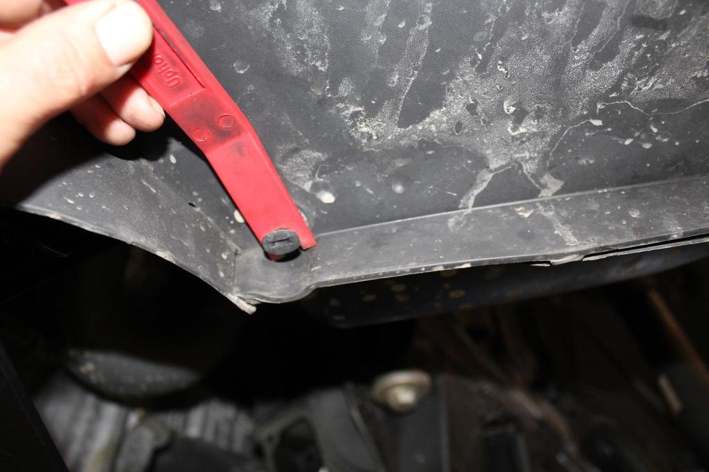 7) Using the same automotive trim removal tool,