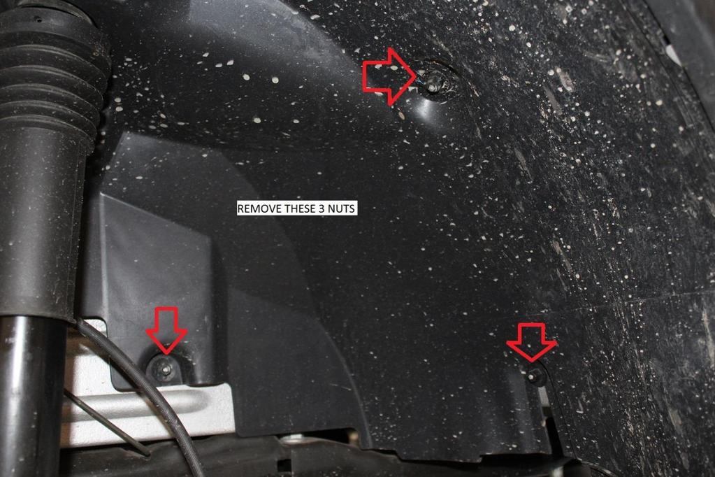 11) Locate and remove the 3 plastic 10mm nuts securing the rear half