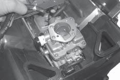 Engines with this feature contain a small secondary spring connected between the governor lever and the lower adjustment tab of the main bracket. See Figure -7.