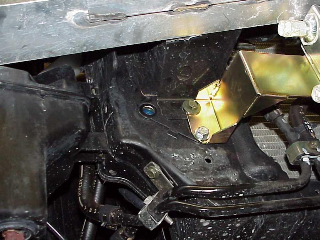 You will be mounting the coolant reservoir in this location with the supplied 8MM bolts. It is shown in photo 29 without the bottle attached for mounting/orientation purposes.