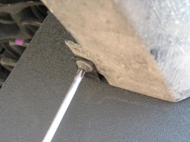 Re-install the last fastener from the fender liner through the angle bracket and tighten to the